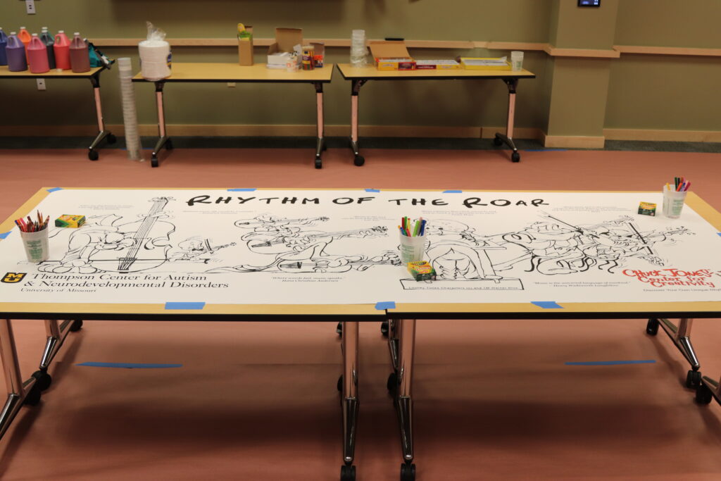 A picture of a white banner with looney tunes characters printed on it.