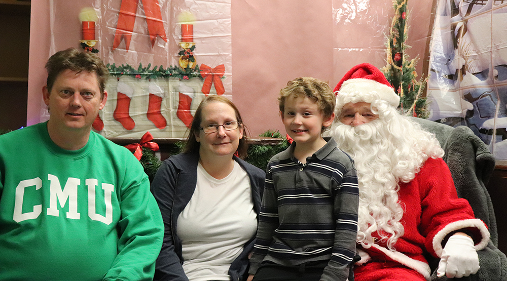 A family visits with santa